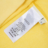 Close-up detail shot of Gucci luxury clothing with signature branding