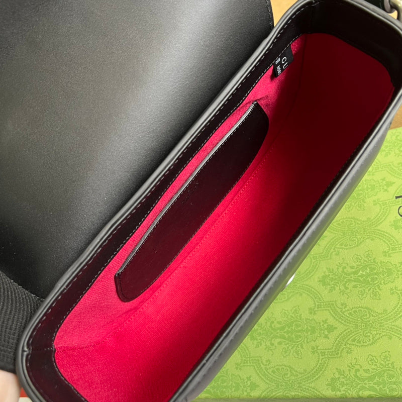 Close-up detail of poised bag design