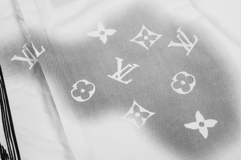 Flat lay presentation of Louis Vuitton luxury clothing with monogram-inspired silhouette
