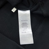 Side profile of Gucci luxury clothing with signature branding