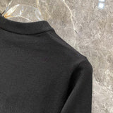 Side profile of Louis Vuitton luxury clothing with label-forward styling