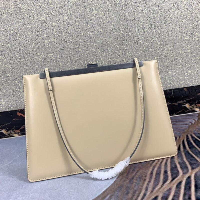 Styled lifestyle shot of sleek modern women's handbag – women's luxury accessory