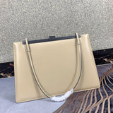 Styled lifestyle shot of sleek modern women's handbag – women's luxury accessory