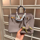 Side view of sleek structured handbag