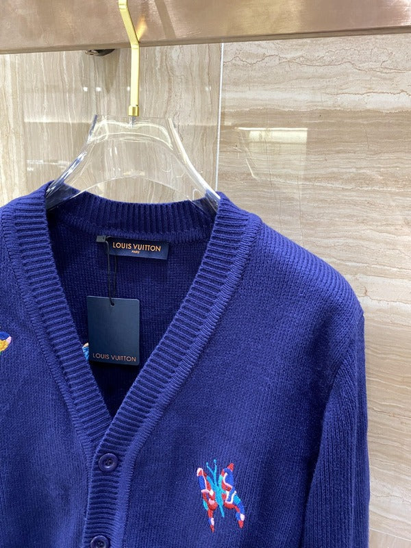 Full styled look of Louis Vuitton luxury clothing with signature branding