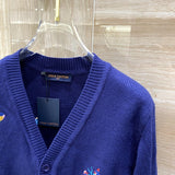 Full styled look of Louis Vuitton luxury clothing with signature branding