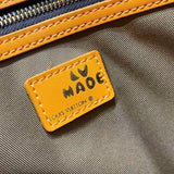 Side profile of refined elevated women's handbag – women's luxury accessory
