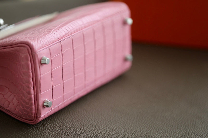 Side view of polished structured handbag