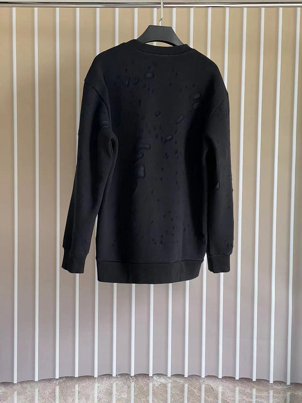 Side profile of Givenchy luxury clothing with logo-detail design