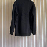 Side profile of Givenchy luxury clothing with logo-detail design