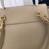 Handle and strap detail of everyday-luxe structured women's handbag – women's statement bag