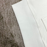 Close-up detail view of Amiri luxury piece style No.100