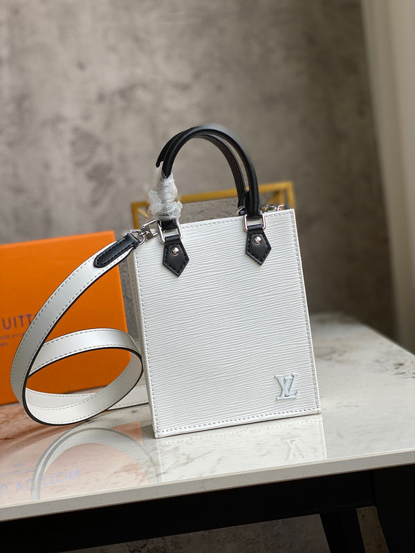 Side profile of classic refined women's handbag – women's luxury accessory