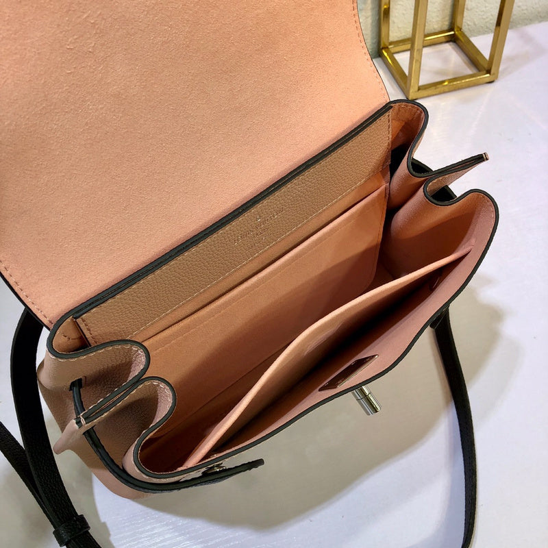 Front view of structured signature women's handbag – women's statement bag