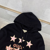 Side profile of Gucci luxury clothing with logo-detail design