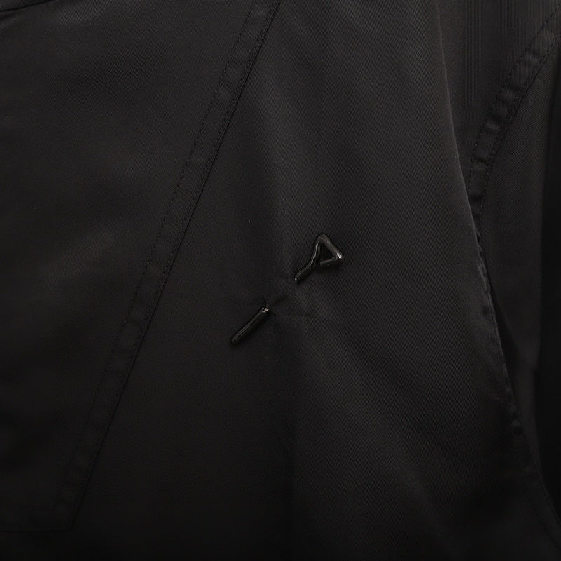 Side profile of Louis Vuitton luxury clothing with logo-detail design