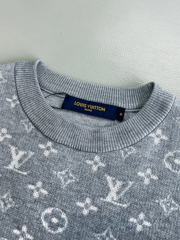 Flat lay presentation of Louis Vuitton luxury clothing with monogram-inspired silhouette