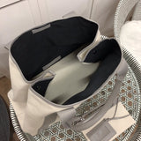 Back view of refined statement women's handbag – women's luxury accessory