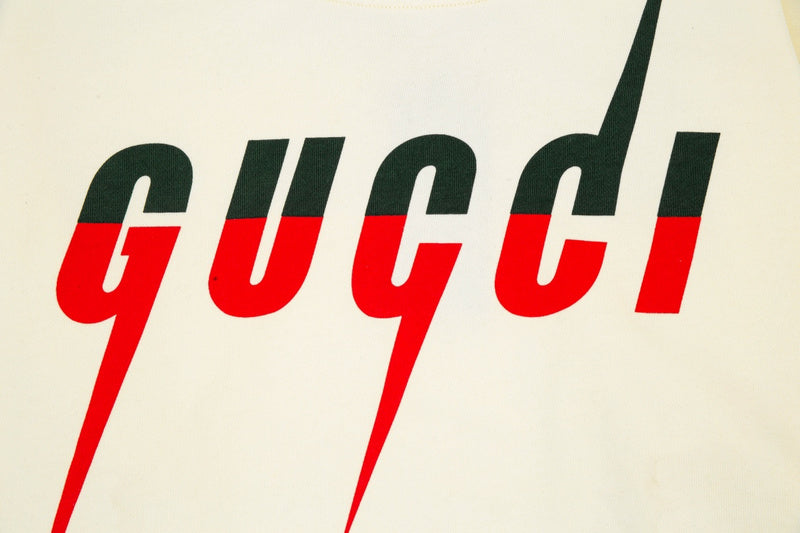 Flat lay presentation of Gucci luxury clothing with relaxed-fit cut