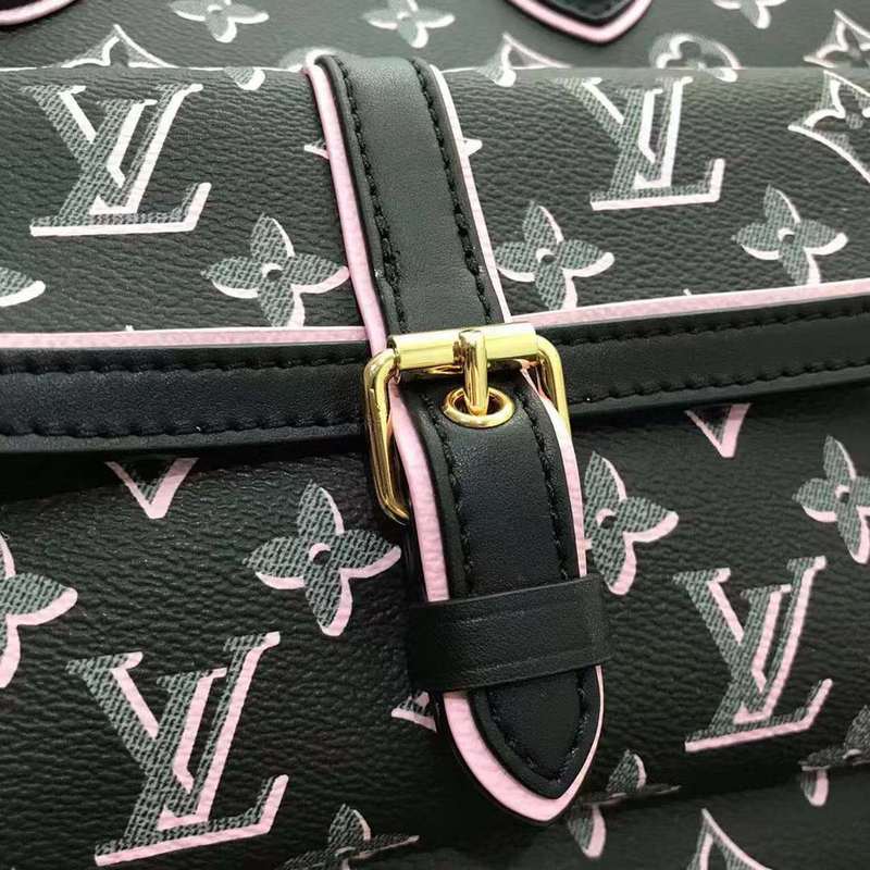 Handle and strap detail of modern statement women's handbag – women's luxury accessory