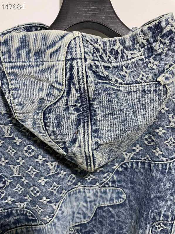 Close-up detail shot of Louis Vuitton luxury clothing with signature branding