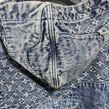 Close-up detail shot of Louis Vuitton luxury clothing with signature branding