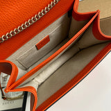 Side profile of structured polished women's handbag – women's luxury accessory