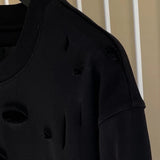 Givenchy clothing detail view — premium authentic designer style