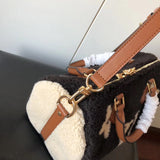 Side profile of signature premium women's handbag – women's statement bag