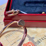 Side view of Cartier unisex jewelry piece