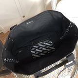 Close-up detail of refined signature women's handbag – women's premium purse
