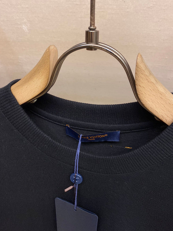 Full styled look of Louis Vuitton cotton t-shirt with signature branding