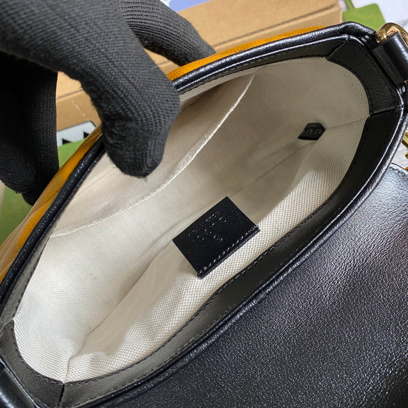 Front view of polished classic women's handbag – women's statement bag