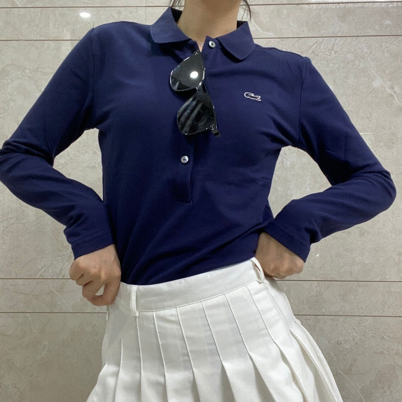 Flat lay presentation of Lacoste luxury clothing with logo-detail design