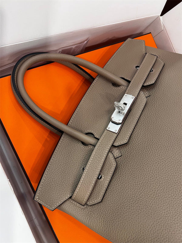  sleek top-handle bag detail view showing craftsmanship