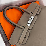  sleek top-handle bag detail view showing craftsmanship