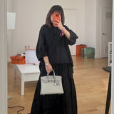 Side view of modernist structured handbag
