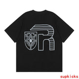 Close-up detail shot of Rhude luxury clothing with logo-detail design