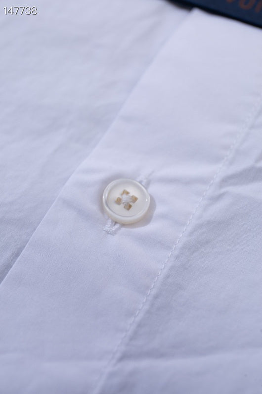 Close-up detail shot of Louis Vuitton luxury clothing with monogram-inspired silhouette