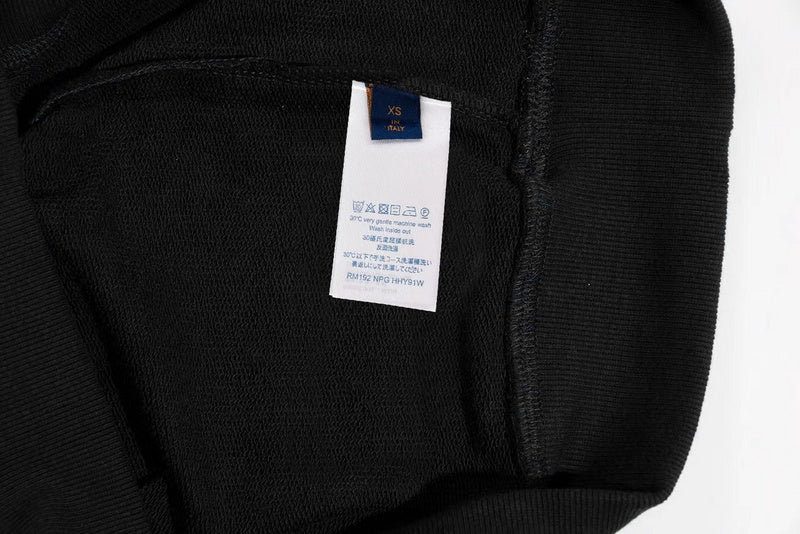 Close-up detail shot of Louis Vuitton luxury clothing with everyday silhouette