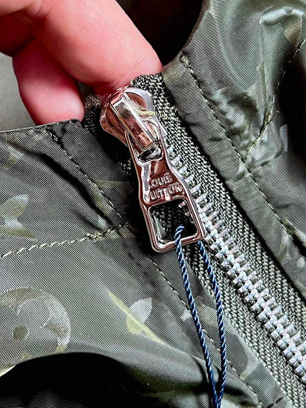 Full styled look of Louis Vuitton luxury clothing with logo-detail design