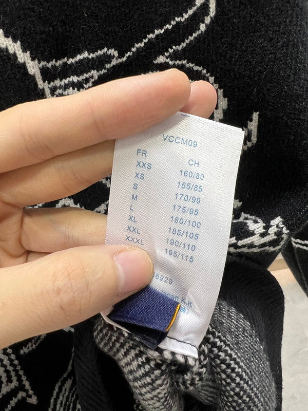 Close-up detail shot of Louis Vuitton luxury clothing with label-forward styling