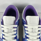 Side profile of Nike classic monochrome sneakers retro runner design