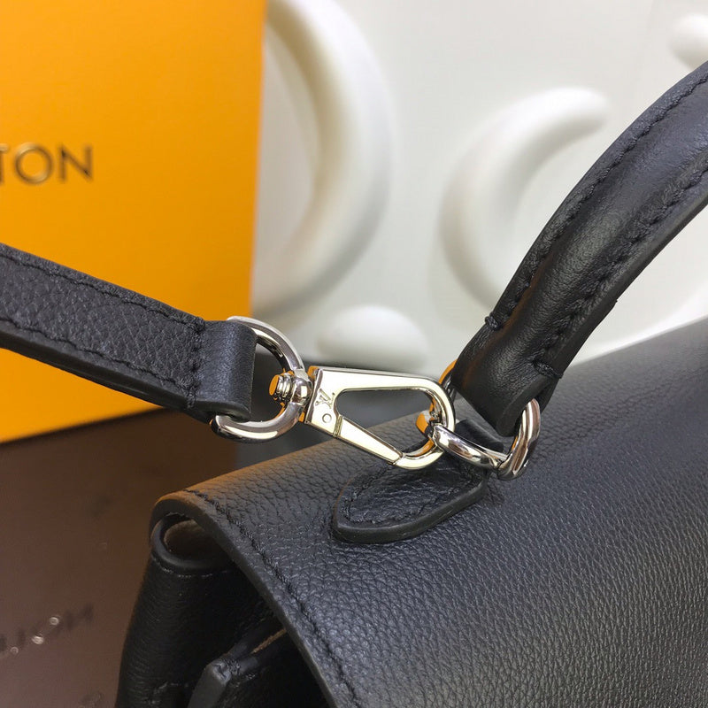 Top view of polished signature women's handbag – women's designer-style accessory