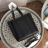 Handle and strap detail of refined everyday-luxe women's handbag – women's luxury accessory