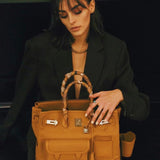 Side view of modern structured handbag