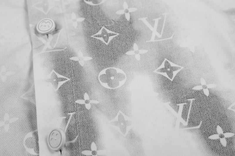 Close-up detail shot of Louis Vuitton luxury clothing with logo-detail design