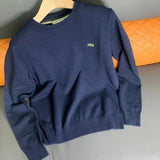 Front view of Lacoste luxury clothing with monogram-inspired silhouette