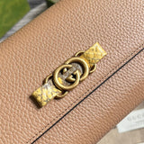 Styled lifestyle shot of polished signature women's handbag – women's designer-style accessory