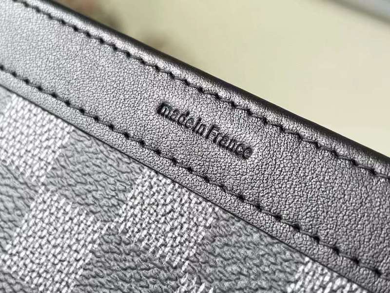 Handle and strap detail of premium signature women's handbag – women's statement bag